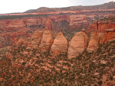 [Side by side tall mounds of rock which were once a solid wall.]